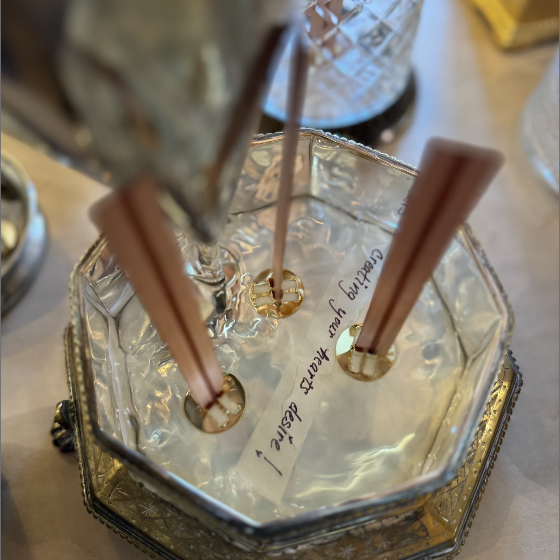 Eleventh House antique candle vessel being filled with non-toxic wax